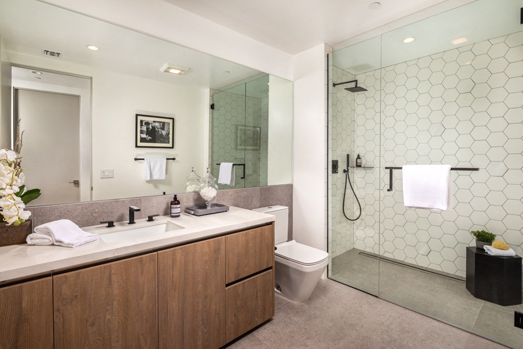 guest bathroom with glass enclosed shower