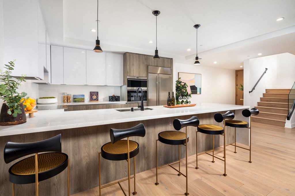 two bedroom kitchen with black barstools