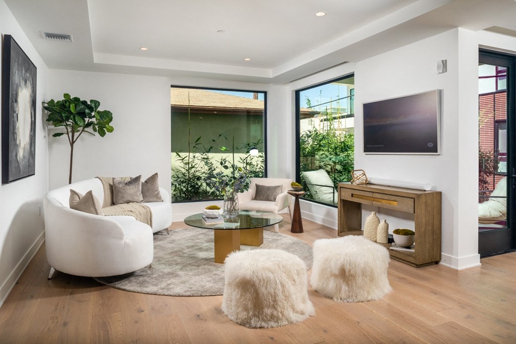 primary bedroom retreat with ottomans