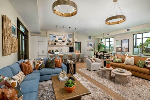 A living room with a blue couch and a wooden coffee table.