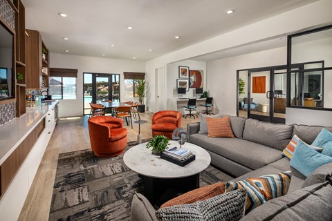 a living room with couches and chairs and a table