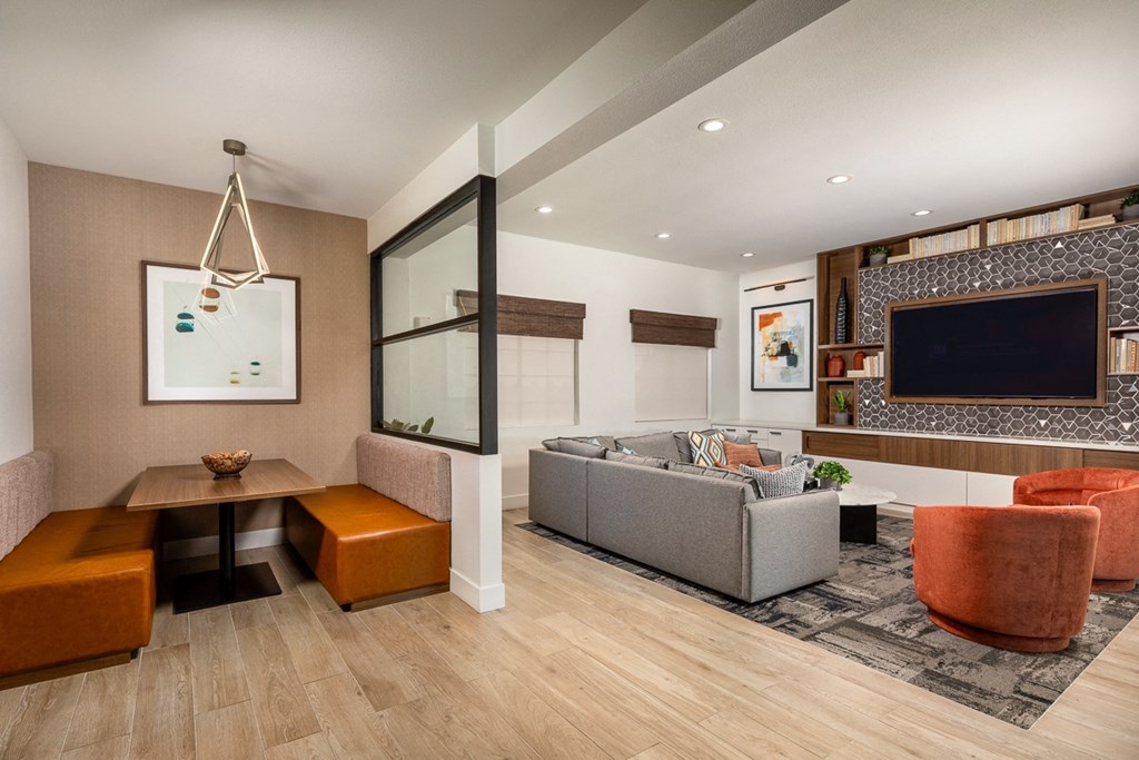 a living room with a couch and a tv