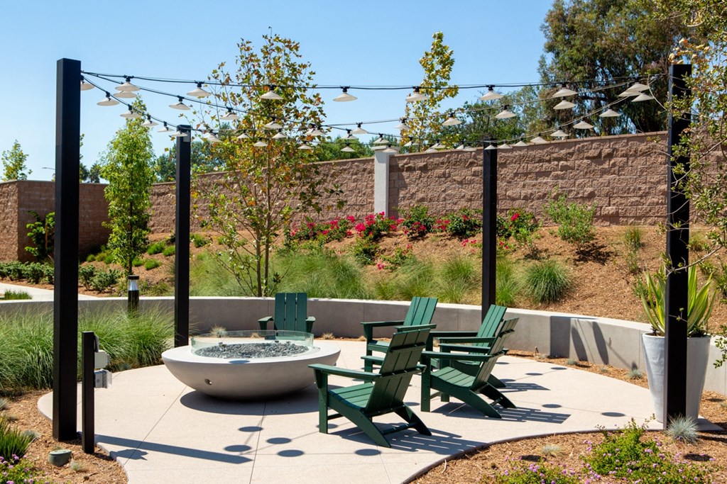 a courtyard with chairs and a fountain