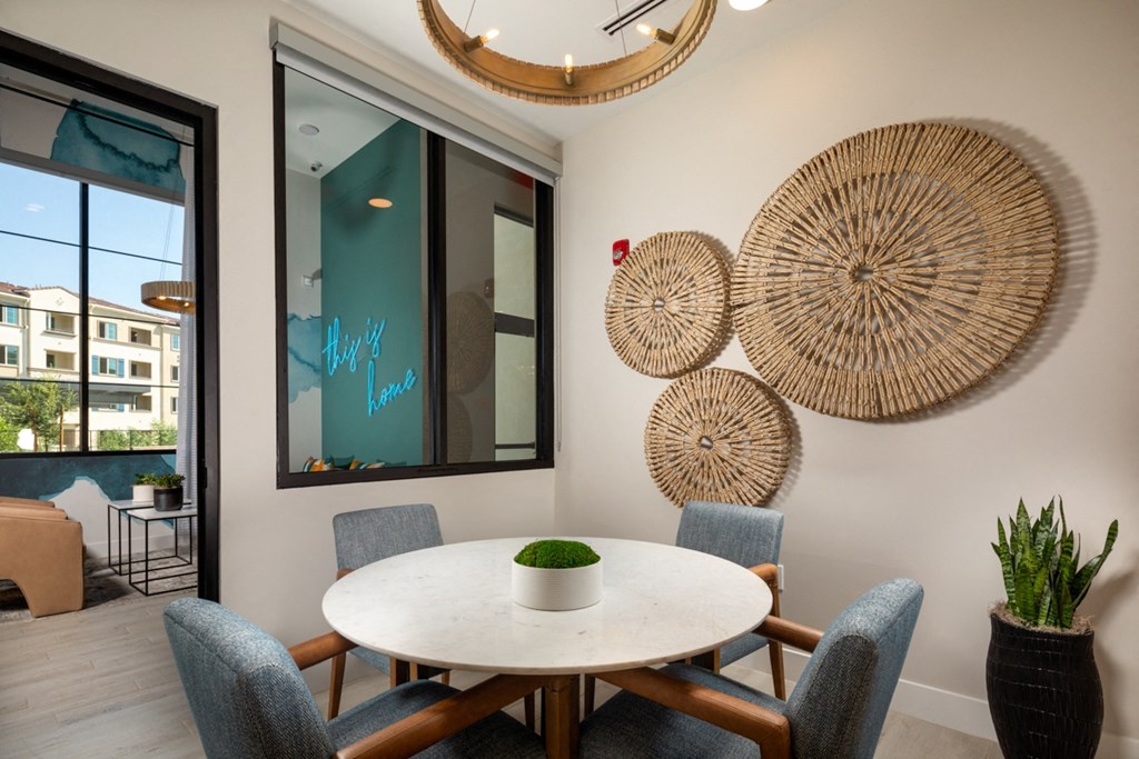 a conference room with a round table and chairs