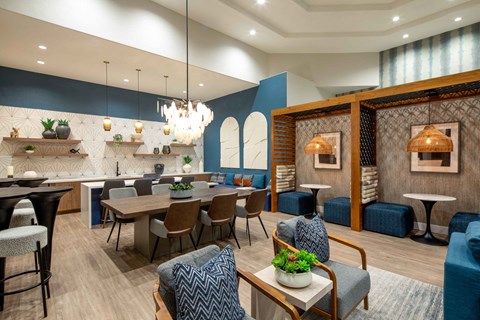 A modern dining room with a wooden table and chairs.