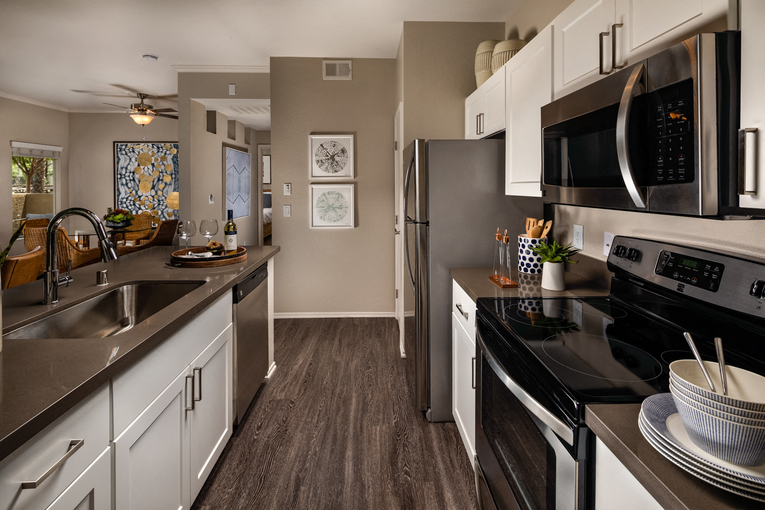 A modern kitchen with a black stove top oven.
