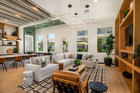 a living room with couches and chairs and a table