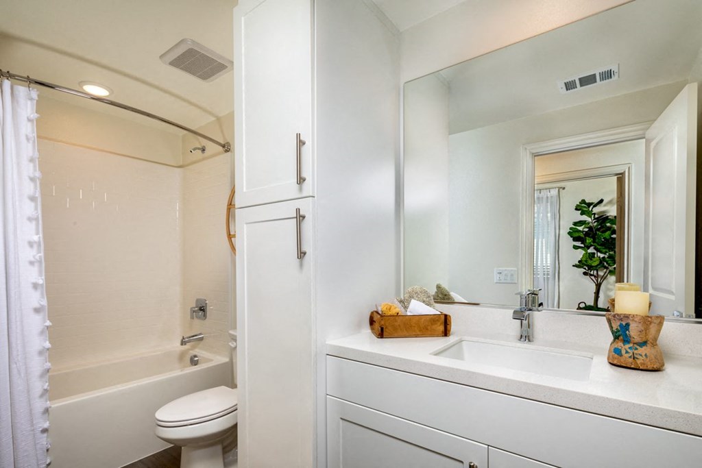 a bathroom with a sink toilet and bathtub