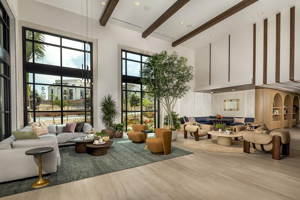 A modern living room with a large window and a view of the city.