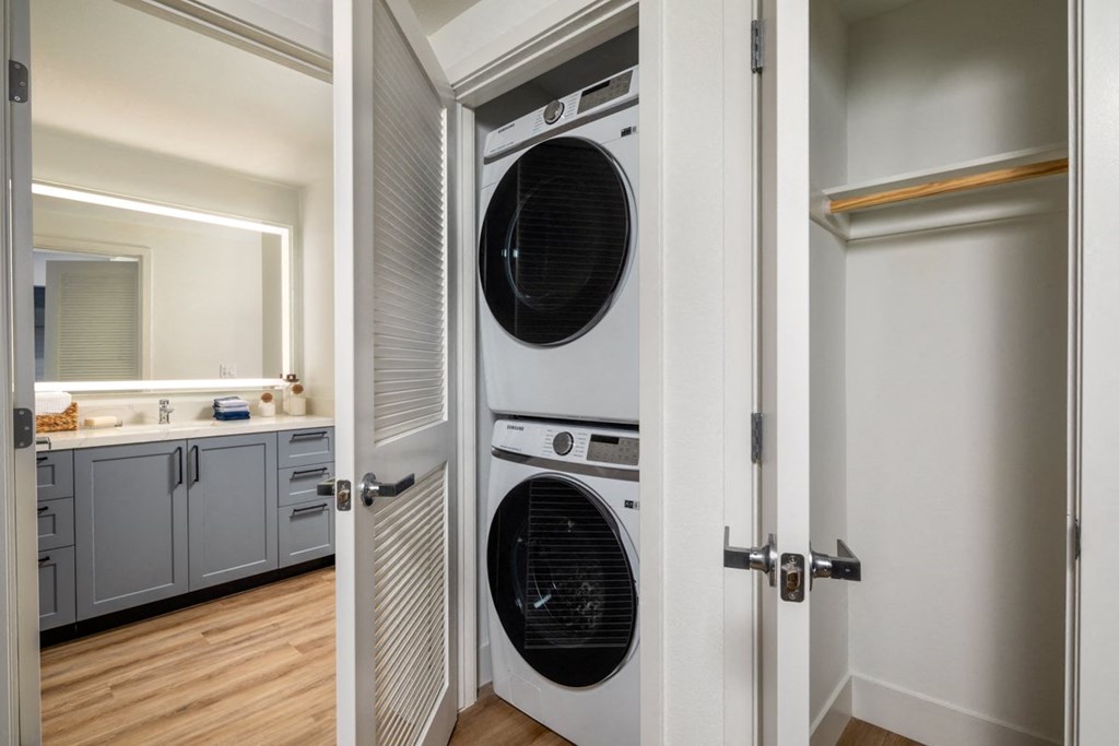 a washer and dryer in a closet in a home