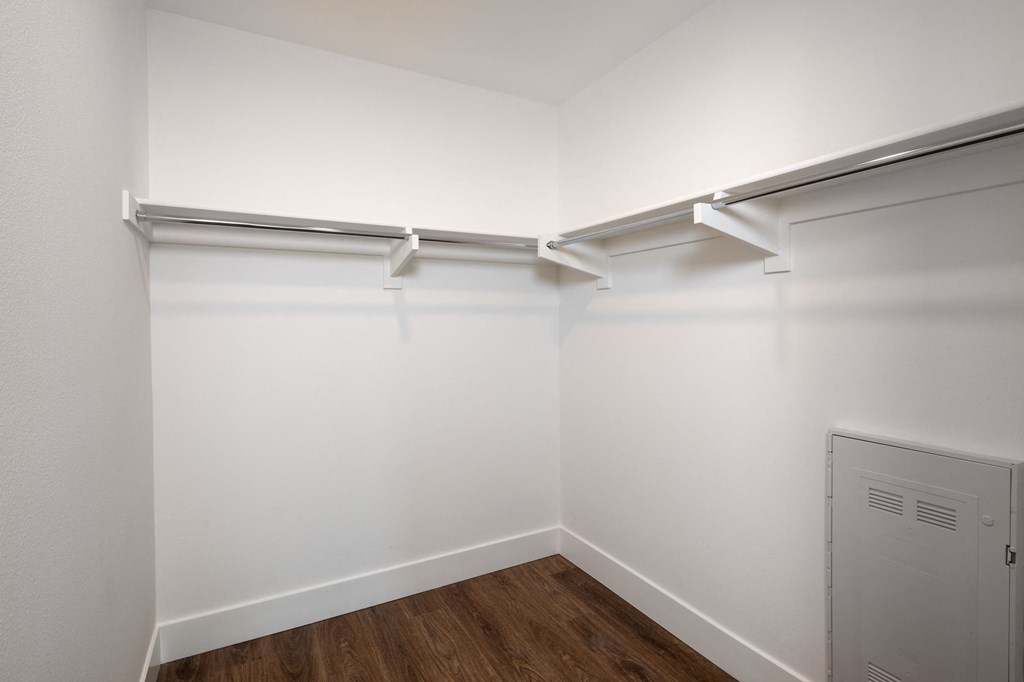 the preserve at ballantyne commons apartment living room with white walls and a closet