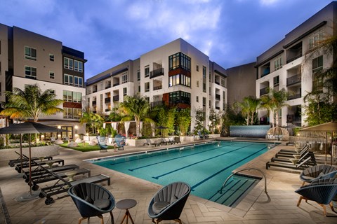 a swimming pool in the middle of an apartment building