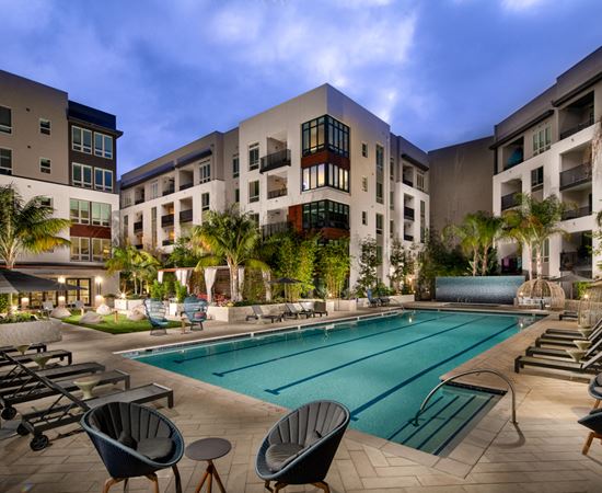 a swimming pool in the middle of an apartment building