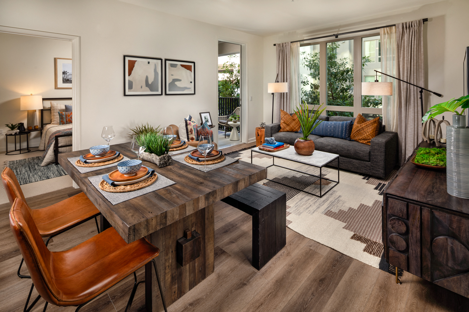 a living room with a dining room table and a couch