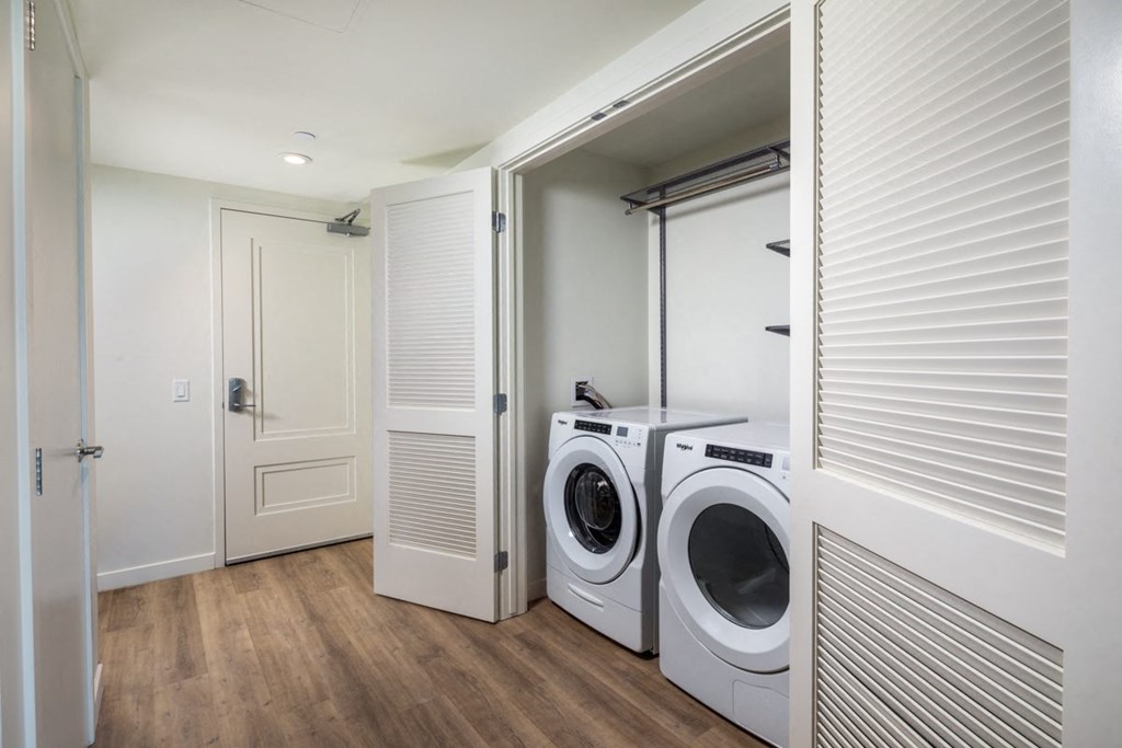 a small laundry room with a washer and dryer