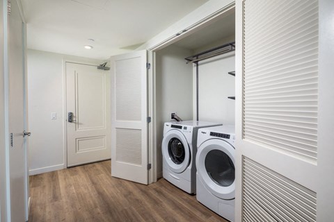 a small laundry room with a washer and dryer