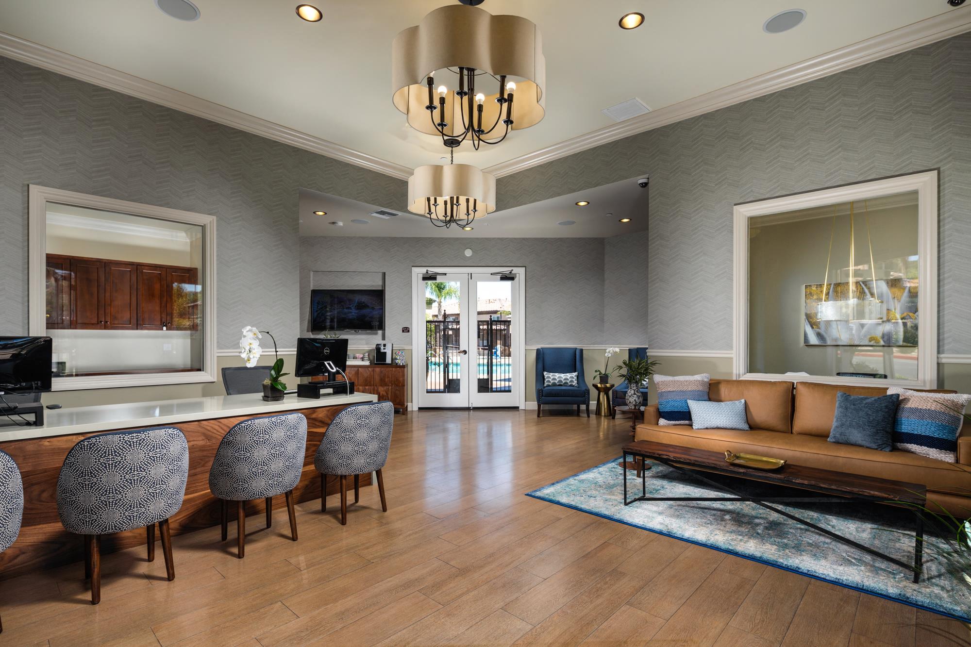 a living room with a couch and a table with chairs