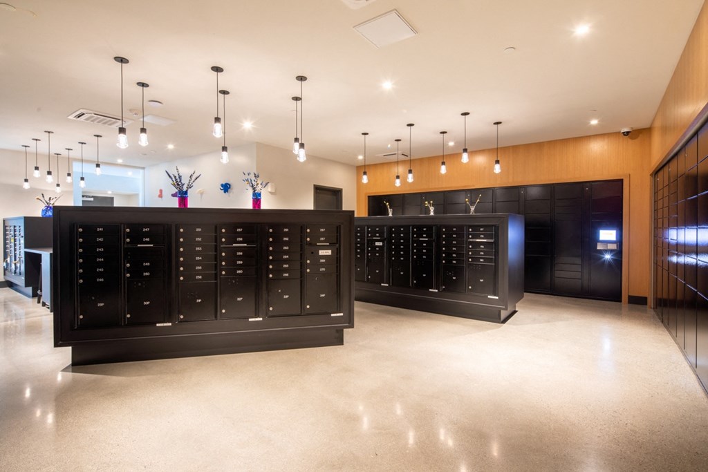 the tasting room has a large wine rack and a counter in the center of it