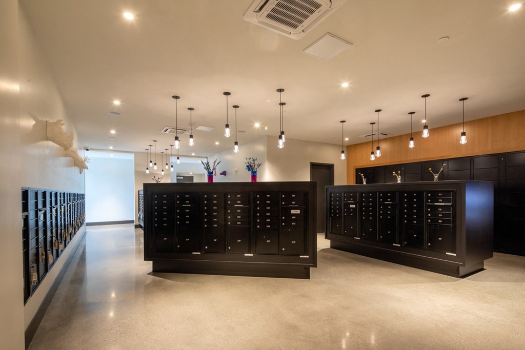 the tasting room has a large wine rack in the center of the room