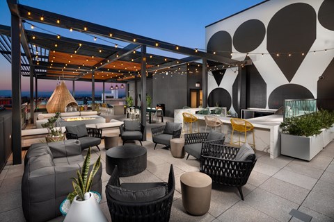 a patio with couches tables and chairs and a roof terrace