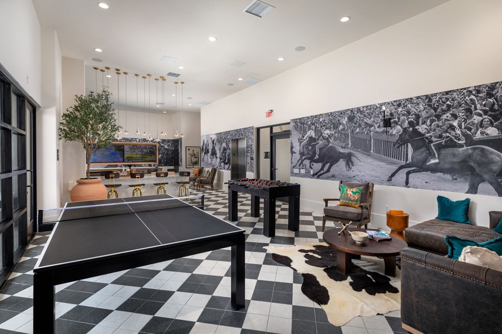 a games room with a ping pong table and foosball