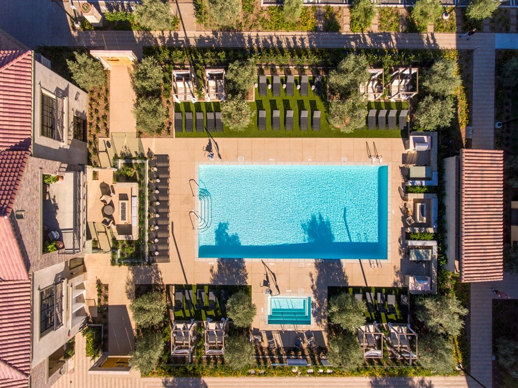 a birds eye view of a swimming pool on the side of a building