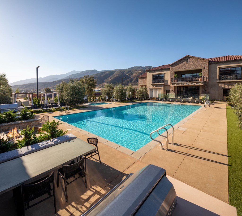 a swimming pool with a building in the background