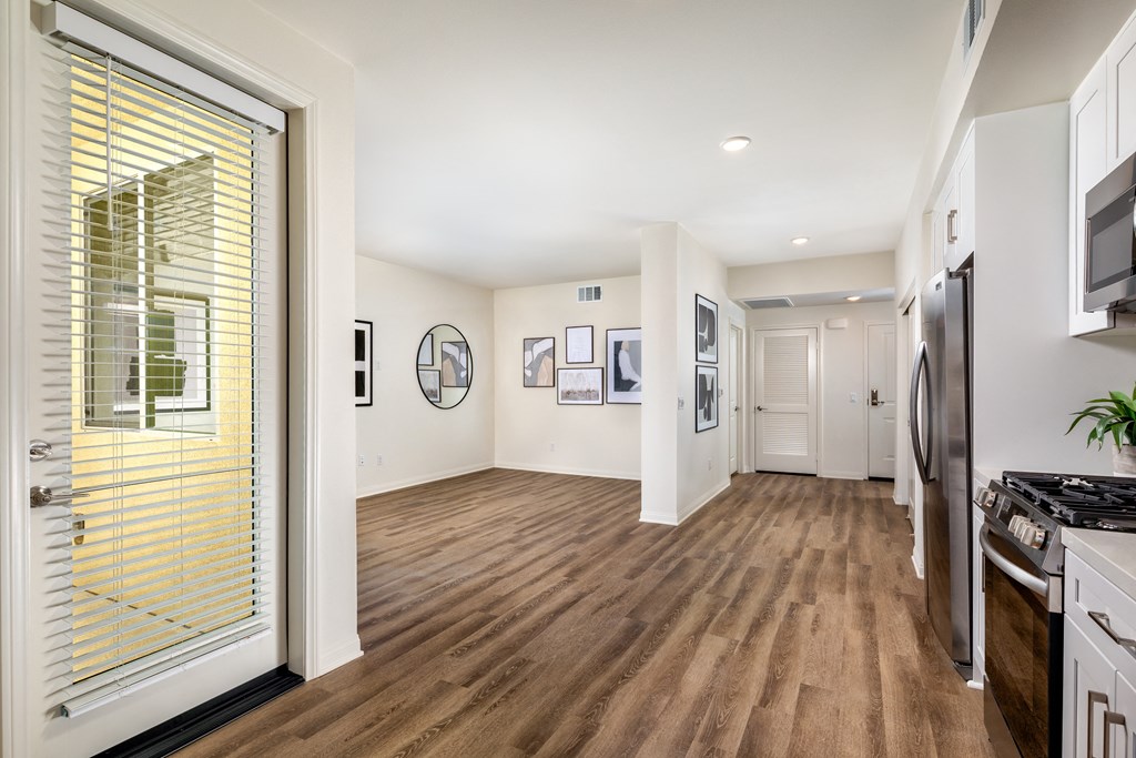 view from the kitchen into the living room and dining room