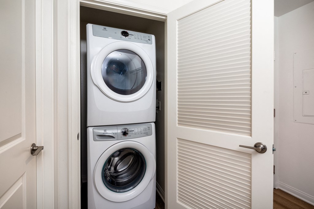 a small laundry room with a washer and dryer