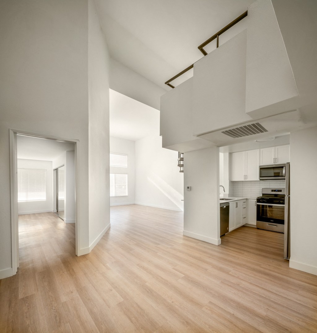 A kitchen with a stove top oven and a microwave.