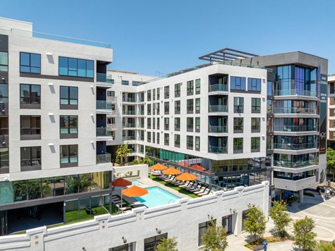 a rendering of a large building with a pool and a courtyard