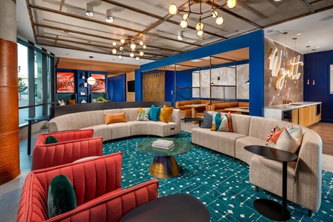 A blue and white room with a couch and chairs.