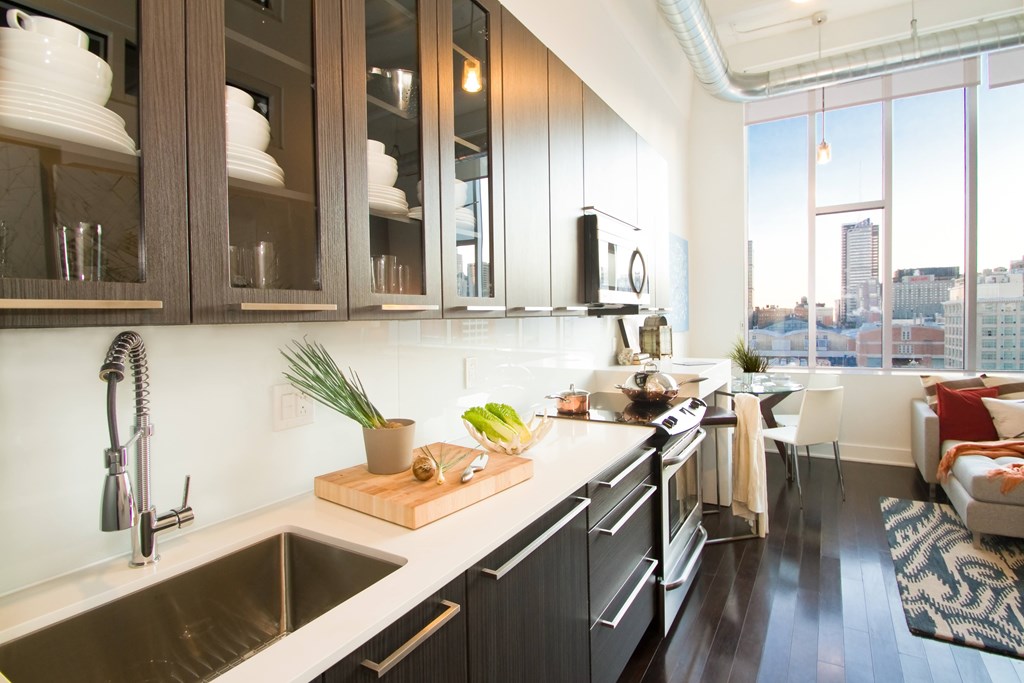 A kitchen with a view of the city.