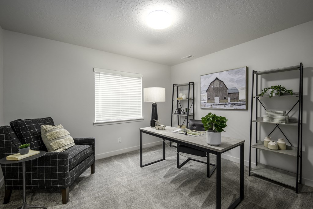 our apartments offer a living room with a desk and a chair