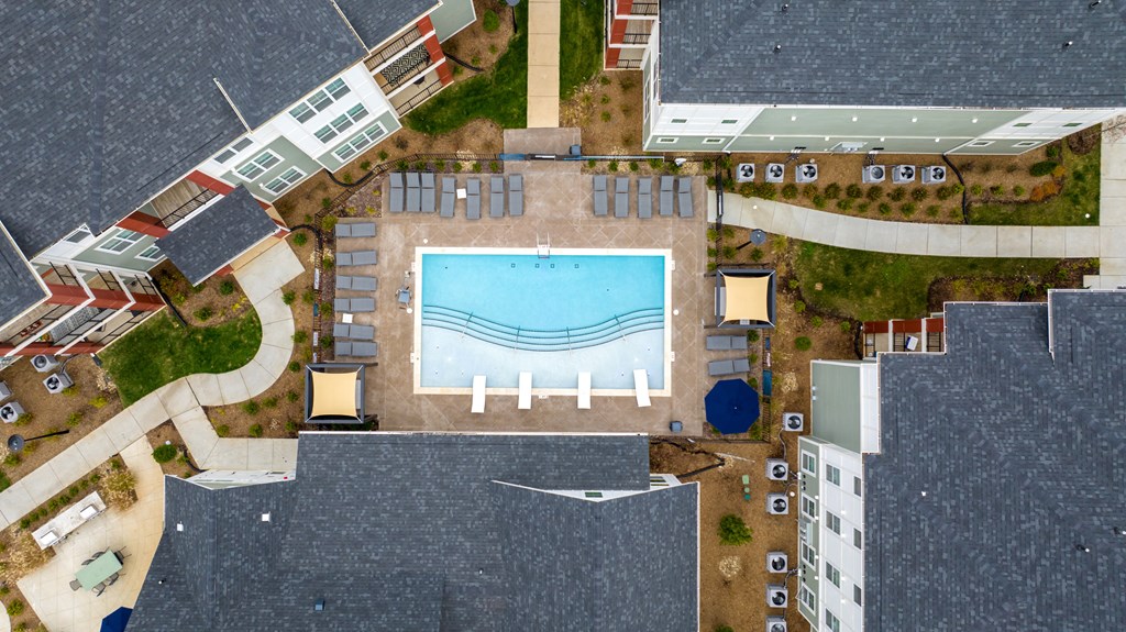arial view of a swimming pool in the middle of a building