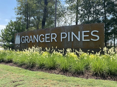 A sign that says Granger Pines at The Village at Granger Pines, Conroe