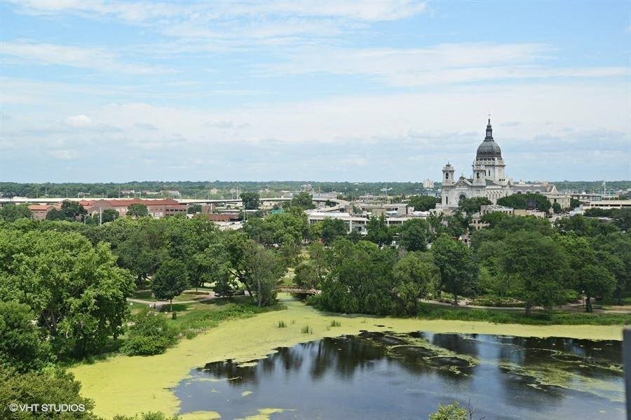 a large body of water with a large building in the background