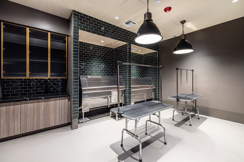 a kitchen with a table and chairs in a room with a grill