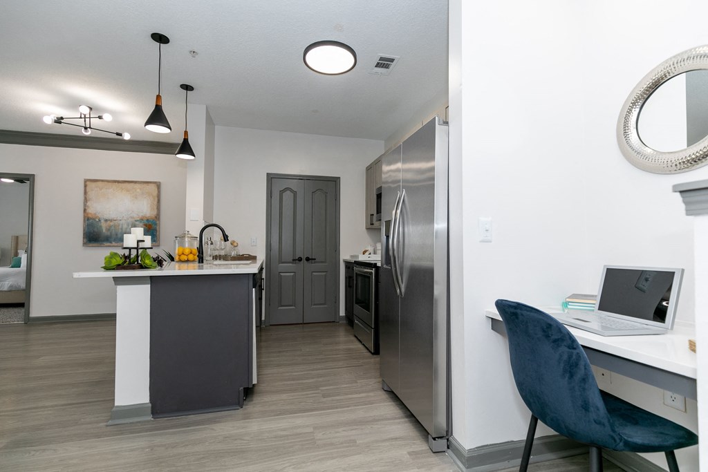 a kitchen and dining area in a 555 waverly unit
