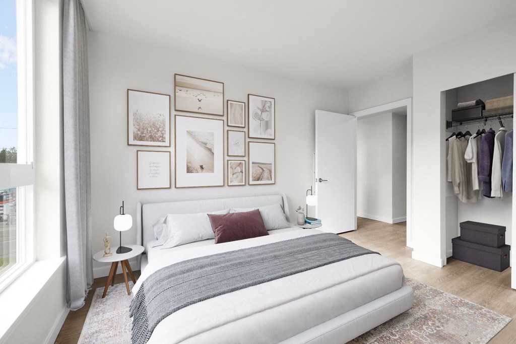 a bedroom with a bed and a dresser in a room at Ion Town Center, Washington, 98133