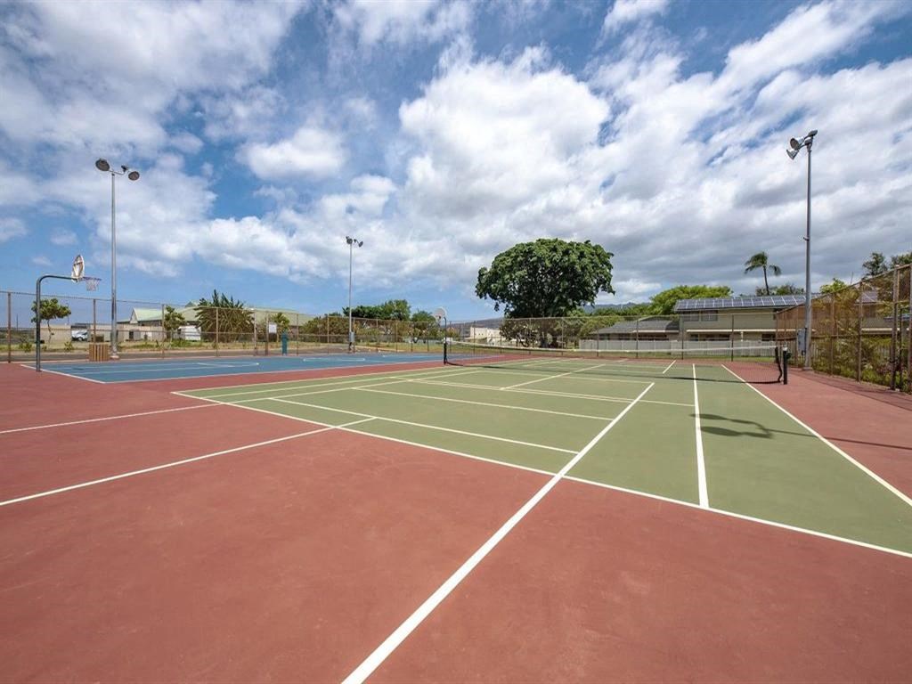 a tennis court with a red and green court