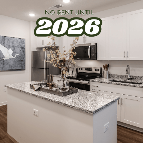 A kitchen with a countertop and a sign that says "NO RENT UNTIL 2026".