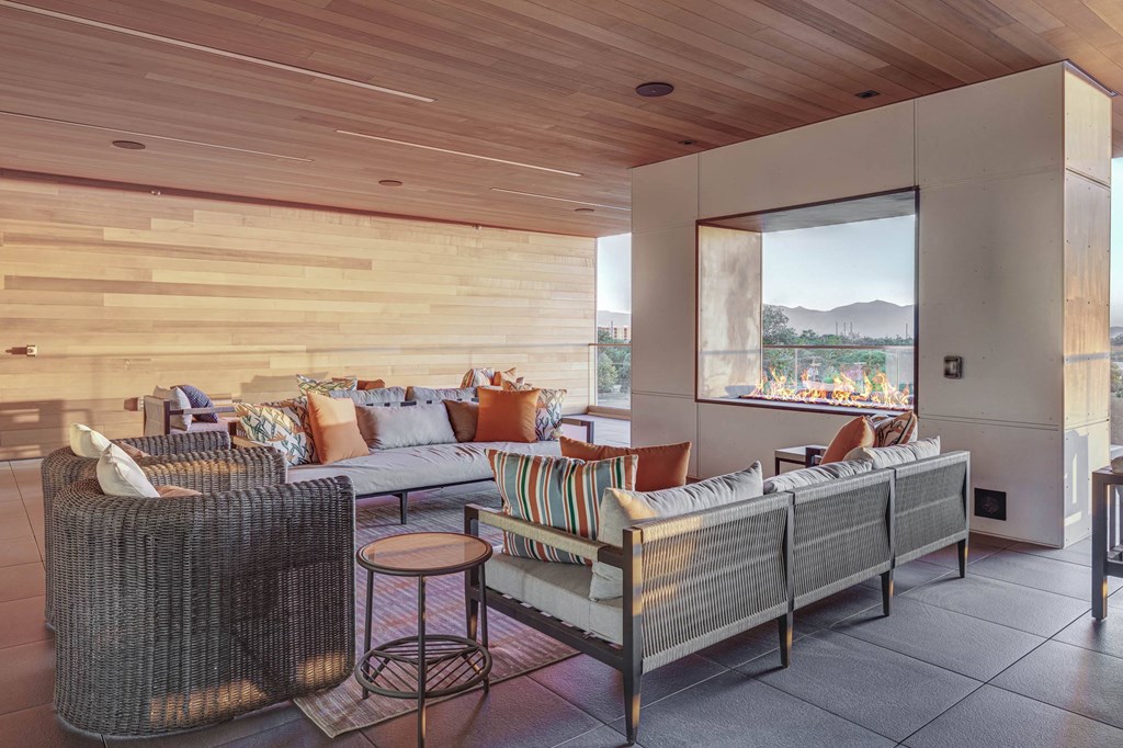 a living room filled with furniture and a large window