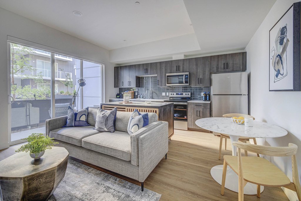 a living room and kitchen in a 555 waverly unit