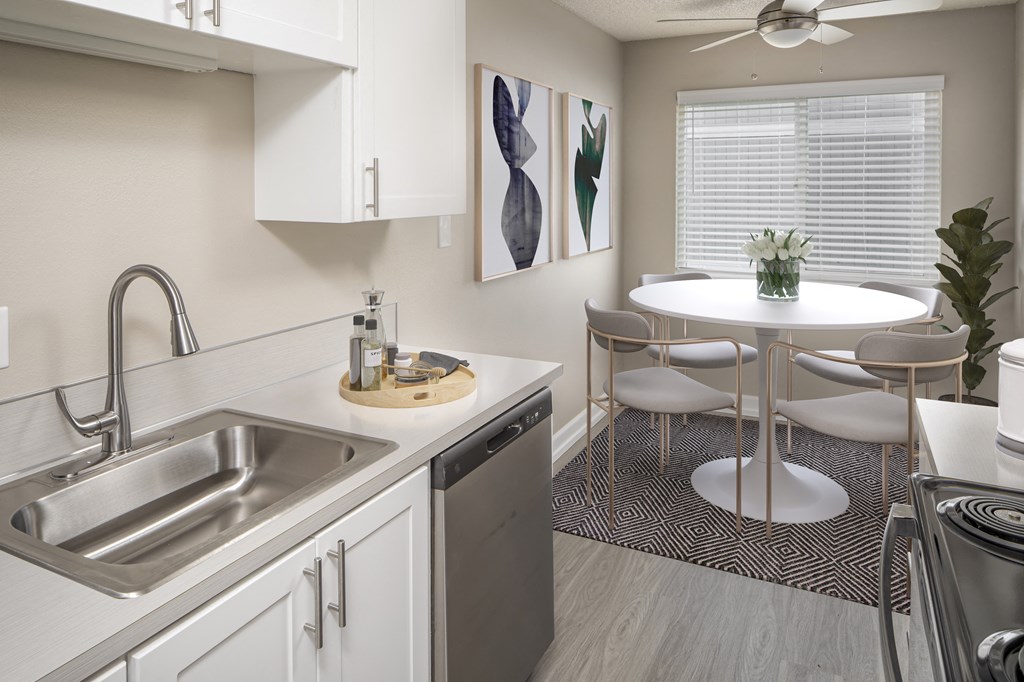 Kitchen and dining space for a circular table with chairs at Canyon Park Apartments, Beaverton, OR 97005