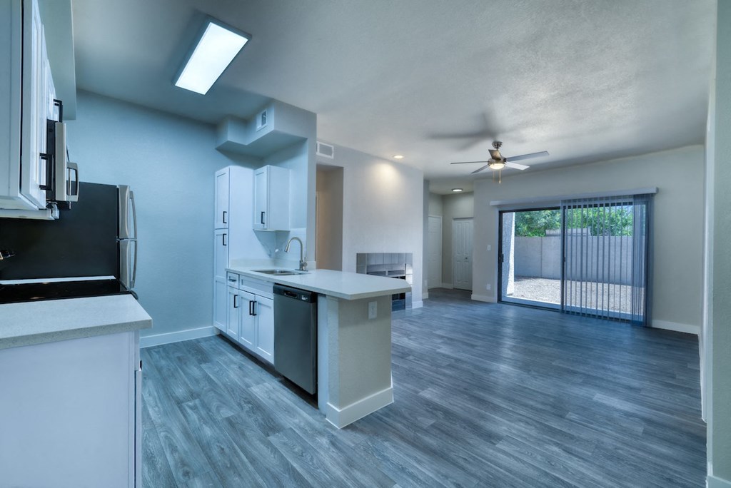 a kitchen and living room in an apartment