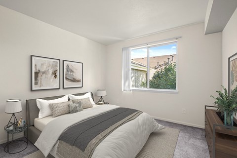 A bedroom with a large bed and two framed pictures on the wall.