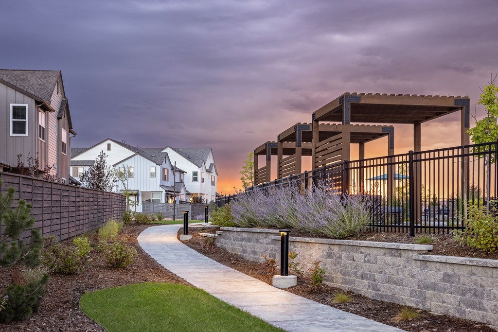 A residential area with a pathway and houses.