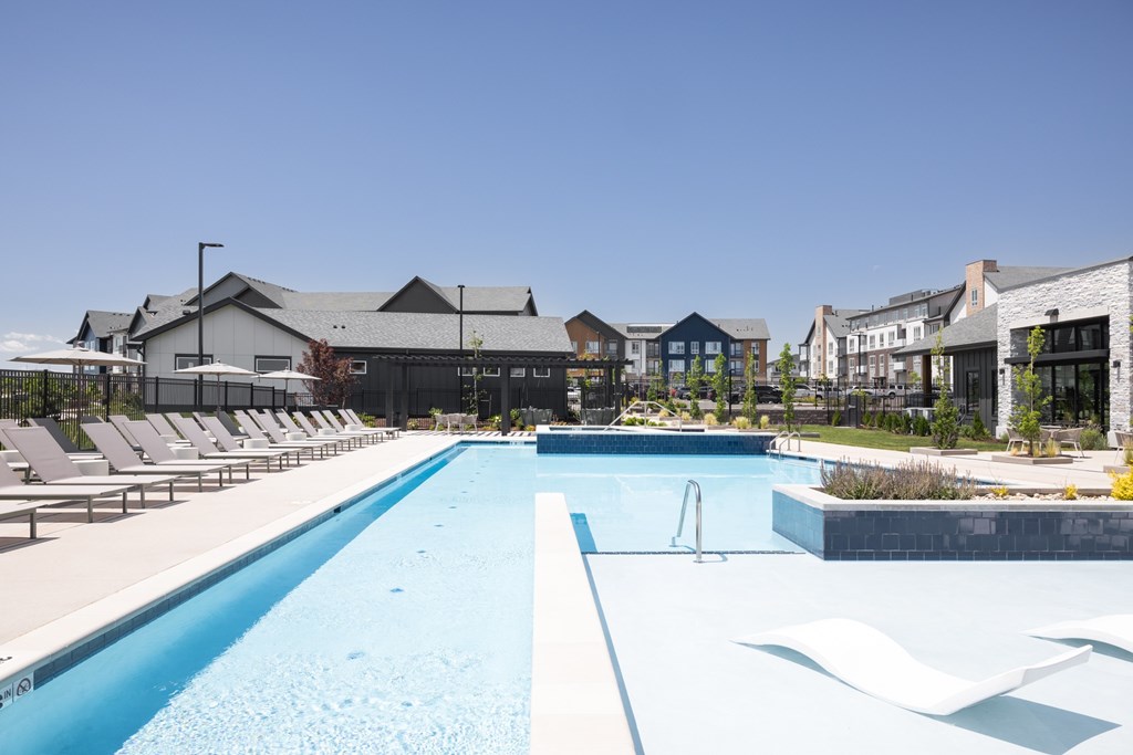 A large swimming pool with a blue line in the middle.