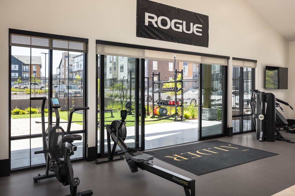 A gym with a sign that says "ROGUE" above the door.